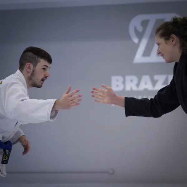 Two Brazier Jiu Jitsu students shaking hands before a roll