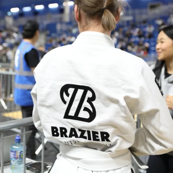 A Brazier Jiu Jitsu athlete in a team gi at a competition
